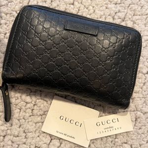 Authentic Gucci Black “GG” wallet